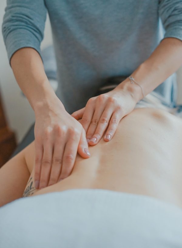 man massaging woman's body